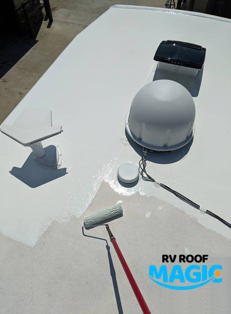 RV roof coated with RV Roof Magic white liquid rubber sealant, sealing vents and AC unit for waterproof protection.