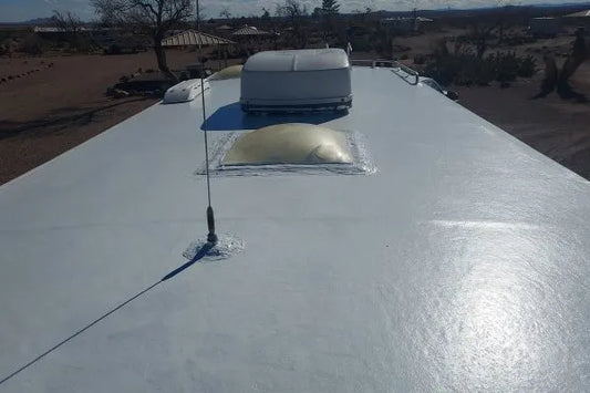RV roof coated with liquid rubber roof coating showing a smooth, waterproof finish and sealed vents for long-lasting rubber roof repair.